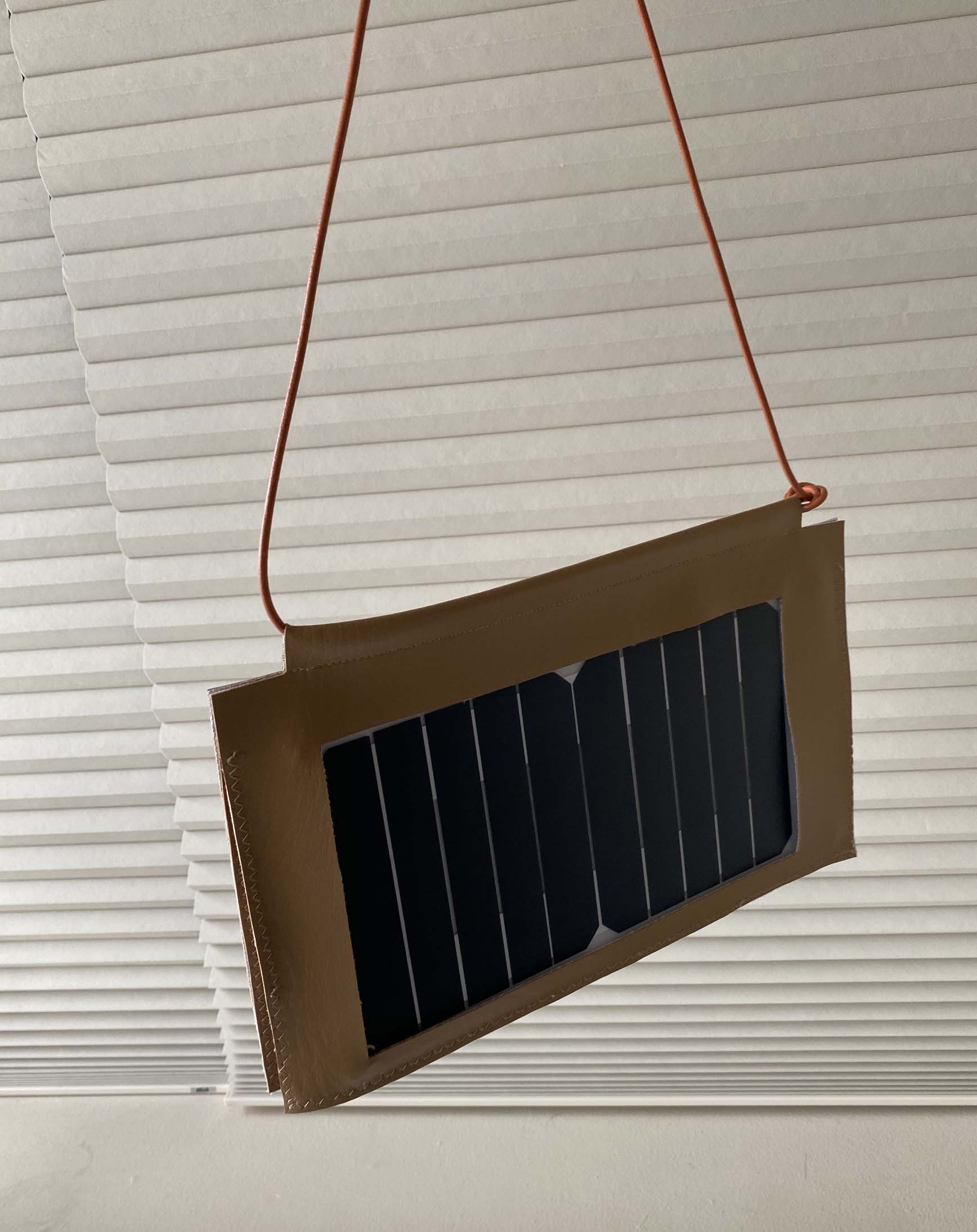 Quarter view of solar phone charger bag.