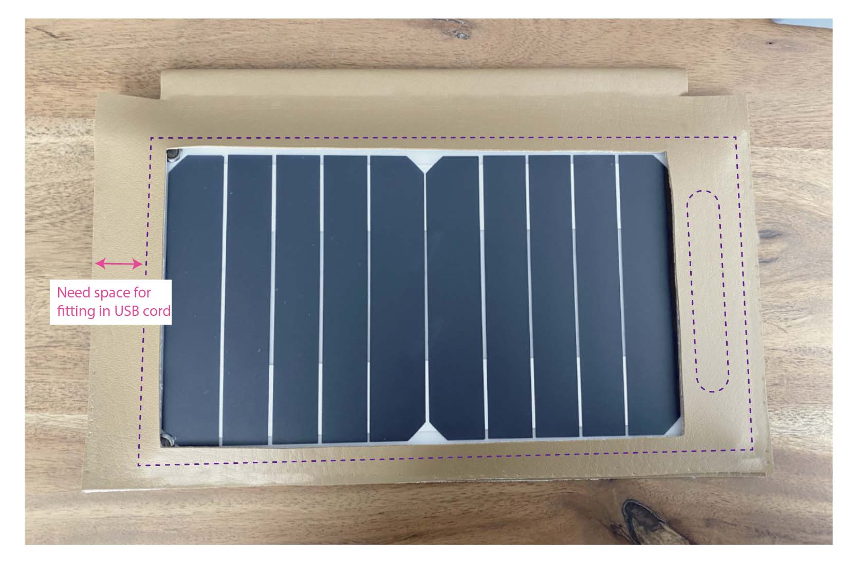 Dotted line indicates where solar panel should be placed. Arrow points out space is needed for fitting in USB cord.